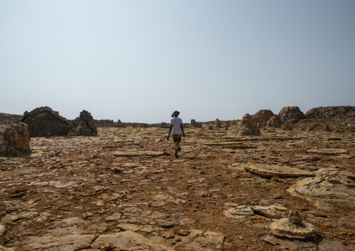Afar man in the volcanic formations of the danakil depression, Afar region, Dallol, Ethiopia
