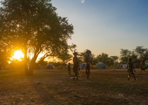 Dimi ceremony at sunset to celebrate circumcision of teenagers in dassanech tribe, Omo valley, Omorate, Ethiopia
