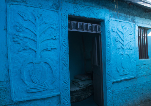 Old blue house with decorations on the walls, Harari region, Harar, Ethiopia