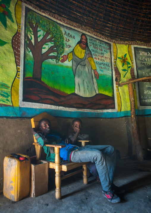 Ethiopia, Kembata, Alaba Kuito, children inside their traditional house with decorated and painted walls