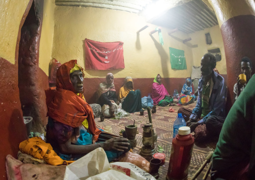 Ethiopian people chewing khat during a sufi ceremony lead by Amir Redwan in Ummi Tahir Nabigar, Harari Region, Harar, Ethiopia