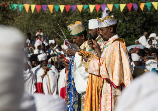 Priests in front of the pool blessing the holy water during Timkat celebrations of epiphany, Amhara region, Lalibela, Ethiopia