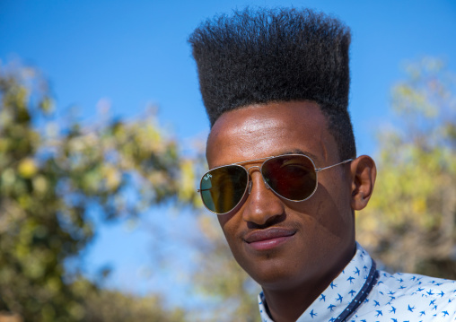 Ethiopian young man with incredible gelled hair, Amhara region, Lalibela, Ethiopia