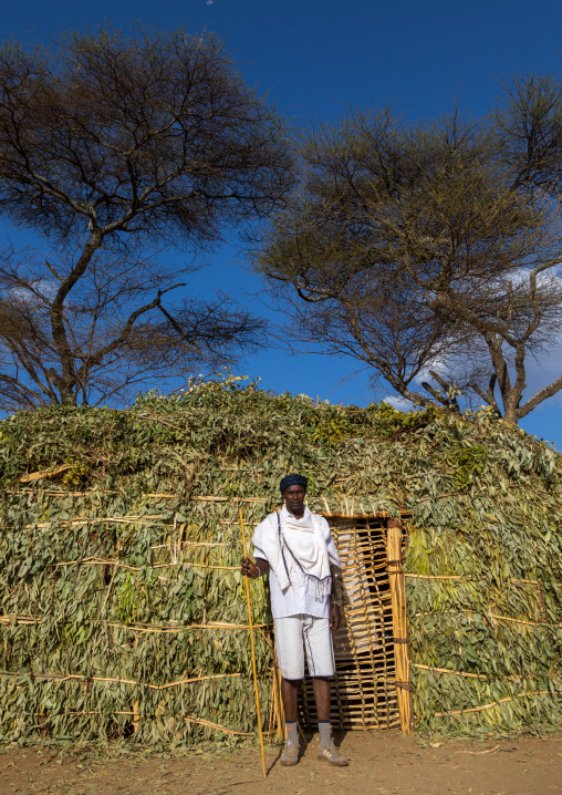 Borana man standing in front of a hut during the Gada system ceremony, Oromia, Yabelo, Ethiopia