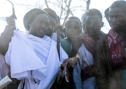 Kura Jarso holding the genitals of a bull during the Gada system ceremony in Borana tribe, Oromia, Yabelo, Ethiopia