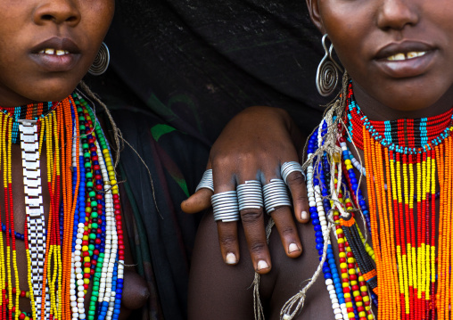 Erbore tribe women with black veils and colourful necklaces, Omo valley, Murale, Ethiopia