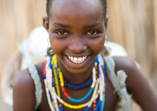 Portrait of a smiling Erbore tribe girl, Omo valley, Murale, Ethiopia