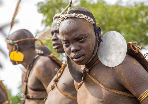 Bodi tribe fat man with giant earrings during Kael ceremony, Omo valley, Hana Mursi, Ethiopia