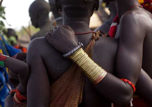 Young women with bracelets during the fat men ceremony in the Bodi tribe, Omo valley, Hana Mursi, Ethiopia