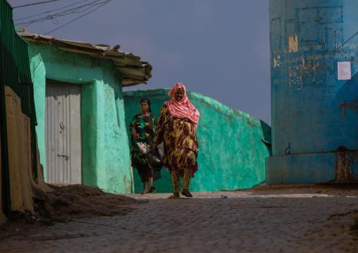 Harari woman walking in the street of the old town, Harari Region, Harar, Ethiopia