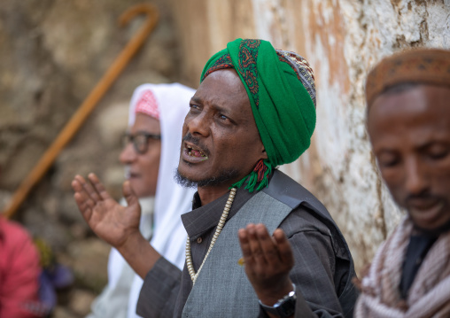 Harari islamic cleric praying during a sufi celebration, Harari Region, Harar, Ethiopia