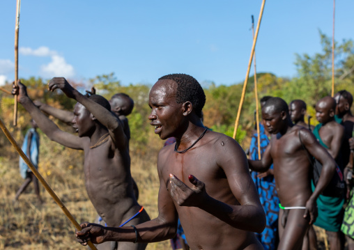 Suri tribe warriors parading before a donga stick fighting ritual, Omo valley, Kibish, Ethiopia