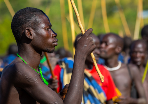 Suri tribe warriors parading before a donga stick fighting ritual, Omo valley, Kibish, Ethiopia