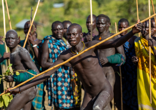 Suri tribe warriors fighting during a donga stick ritual, Omo valley, Kibish, Ethiopia