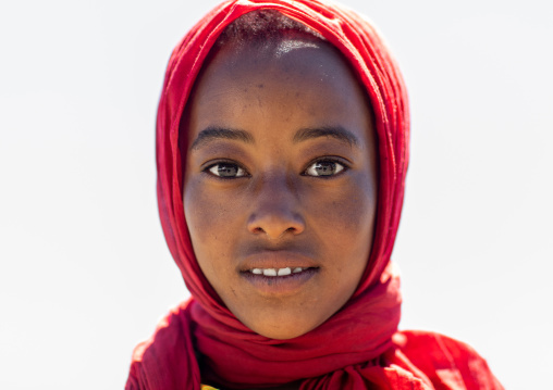 Portrait of an ethiopian teenage girl from  the highlands with a red scarf, Oromia, Sheno, Ethiopia