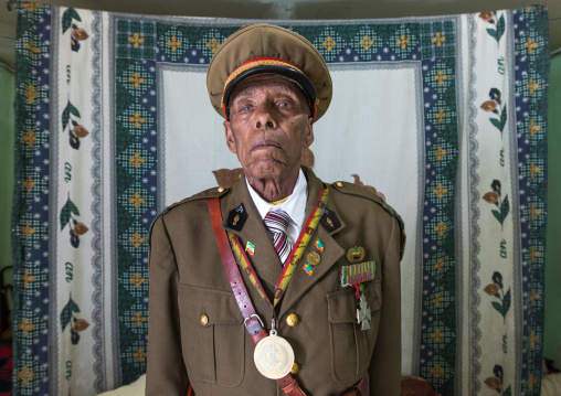 Ethiopian veteran from the italo-ethiopian war in army uniform in his home, Addis Ababa Region, Addis Ababa, Ethiopia