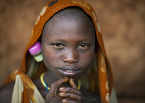 Suri tribe girl with enlarged earlobe, Kibish, Omo valley, Ethiopia