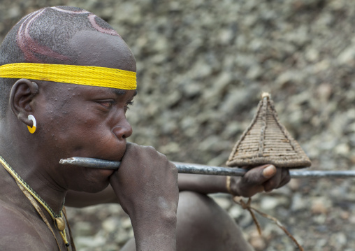 Bodi Tribe Blowing In A Local Trumpet For Kael Ceremony, Hana Mursi, Omo Valley, Ethiopia