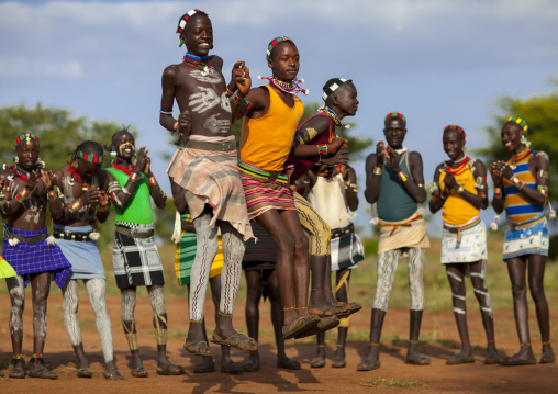 Bashada Tribe Men Dancing And Jumping, Dimeka, Omo Valley, Ethiopia