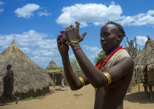 Karo Peowoman Taking Pictures During A Ceremony, Duss, Omo Valley, Ethiopia