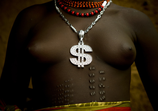 Detail Of The Chest Of A Bodi Tribe Woman With Scarifications And Wearing A Silver Dollar Shaped Pendant, Hana Mursi, Omo Valley, Ethiopia