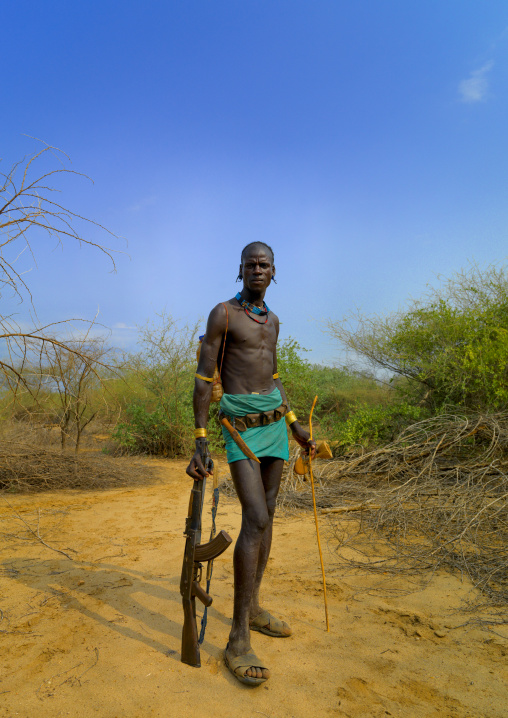 Standing Bana Man In Loincloth With Kalashnikov Rifle In Hand Ethiopia