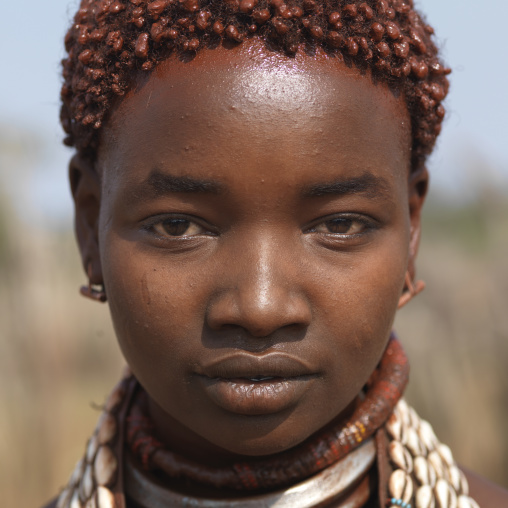 Portrait Of Ochre Dyed Short Hair Hamer Woman Ethiopia