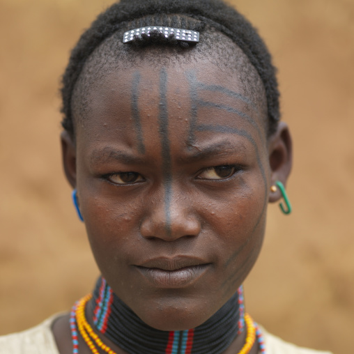 Tsemay tribe woman with tattooed face, Omo valley, Ethiopia