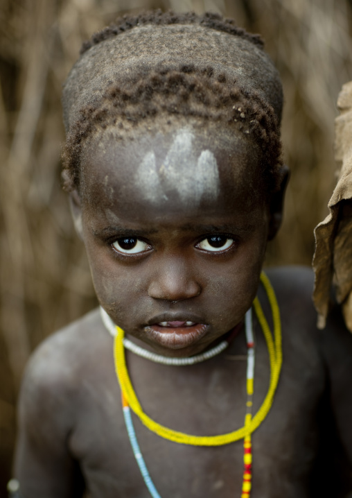 Young Mursi Child With Traditional Hairstyle And Beaded Necklace Ethiopia