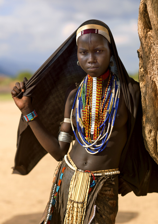 Portrait Of An Erbore Tribe Woman With Black Veil And Colourful Necklaces, Weito, Omo Valley, Ethiopia