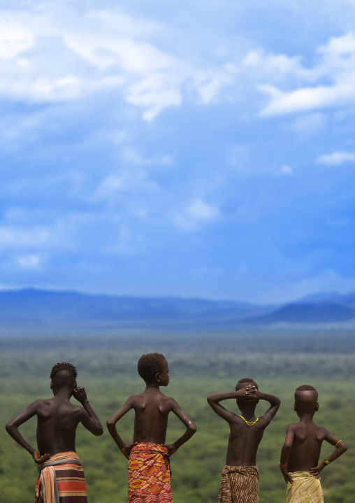 Rear View Of Karo Tribe Kids Looking At The Landscape, Korcho Village, Ethiopia