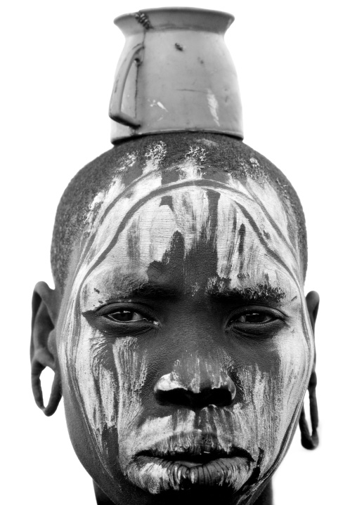 Black And White Portrait Of A Mursi Tribe Woman With A Cup On Her Head In Mago National Park, Omo Valley, Ethiopia