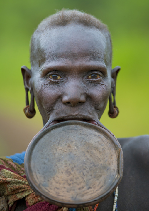 Prtrait of a Suri tribe woman with a lip plate, Kibish, Omo valley, Ethiopia