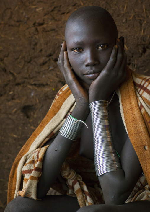 Beautiful Suri tribe woman with impressive bracelets, Kibish, Omo valley, Ethiopia