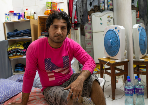 Afghan refugee in a tiny apartment, Special Administrative Region of the People's Republic of China , Hong Kong, China
