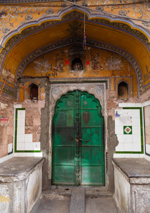 Green wooden door of an old haveli, Rajasthan, Jaipur, India