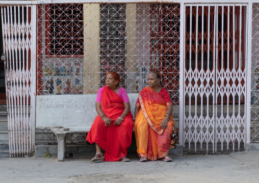 Portrait of rajasthani women sit on a bench in the street, Rajasthan, Jaipur, India