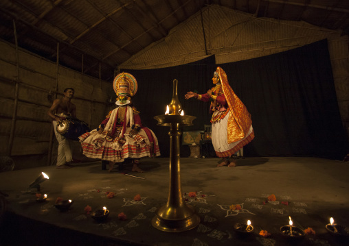 Kathakali Dancers With Traditional Clothings And Make Up Accompanied By A Maddalam Player, Kochi, India
