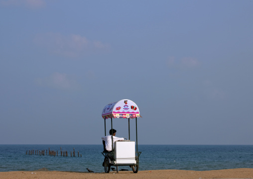 Ice Cream Seller Sitting On His Delivery Tricycle On The Beach, Pondicherry, India