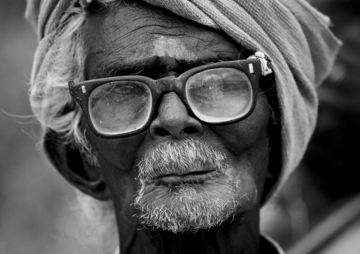Old Keeper Of The Ayyanar Temple Wearing Glasses And A Turban, Pudukkottai, India