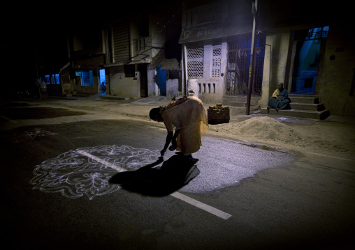 Woman In Sari Bent Down Drawing Drawing Kolam For A Ceremony In The Street, Trichy, India