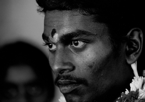 Young Groom With Traditional Painting On His Forehead Looking Far Awy With Concentration During The Wedding, Trichy, India