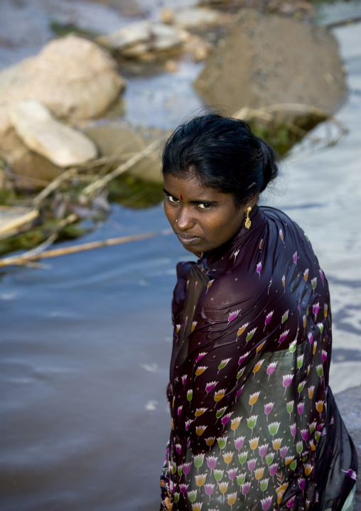 Young Soaked Woman With Dark Hairs And Eyes Getting Out Of The Water In A Village Near Madurai, India