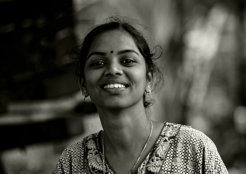 Young Woman With Bindi And Earrings Showing Her White Teeth, Madurai, India