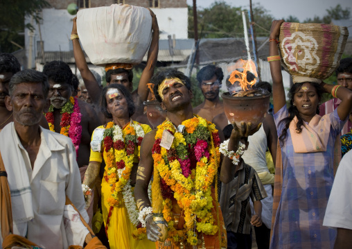 Indian People  With Traditional Painting On The Forehead In Procession Holding Jar On Fire And Offerings During Fire Walking Ritual, Madurai, South India