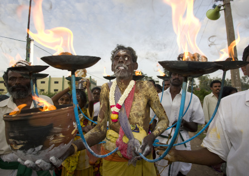 Old Man With Peaks In The Tongue, Covered With Yellow Paste And Holding A Jar On Fire Ready For Fire Walking Ceremony, Madurai, South India