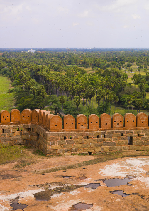 Views Over The Countryside Behind The Carved Stone Blocks On The Rampart Of The Tirumayam Fort, Tirumayam, India