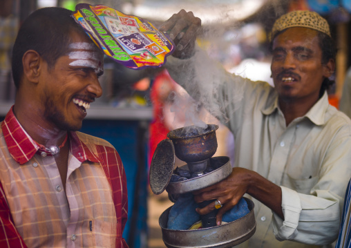 Men During Insence Purification On Madurai Market, India