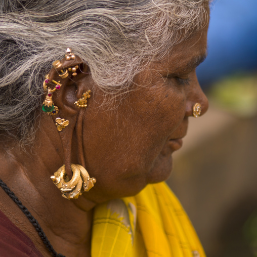 Hindu Woman With Several Earrings And Rings Hung At Her Ears, Madurai, India