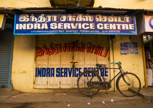 Old Bicycle On Kickstand Parked In Front Of A Closed Store In Chennai, India